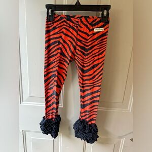 Size 4 Sew Sassy icing ruffle pants - navy and orange tiger print